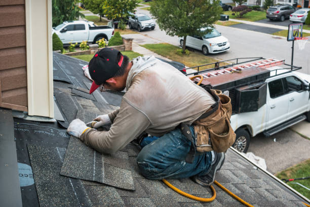 Professional Roofing technician working in Lily, KY